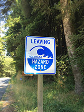 photo of sign that reads leaving tsunmai hazard zone